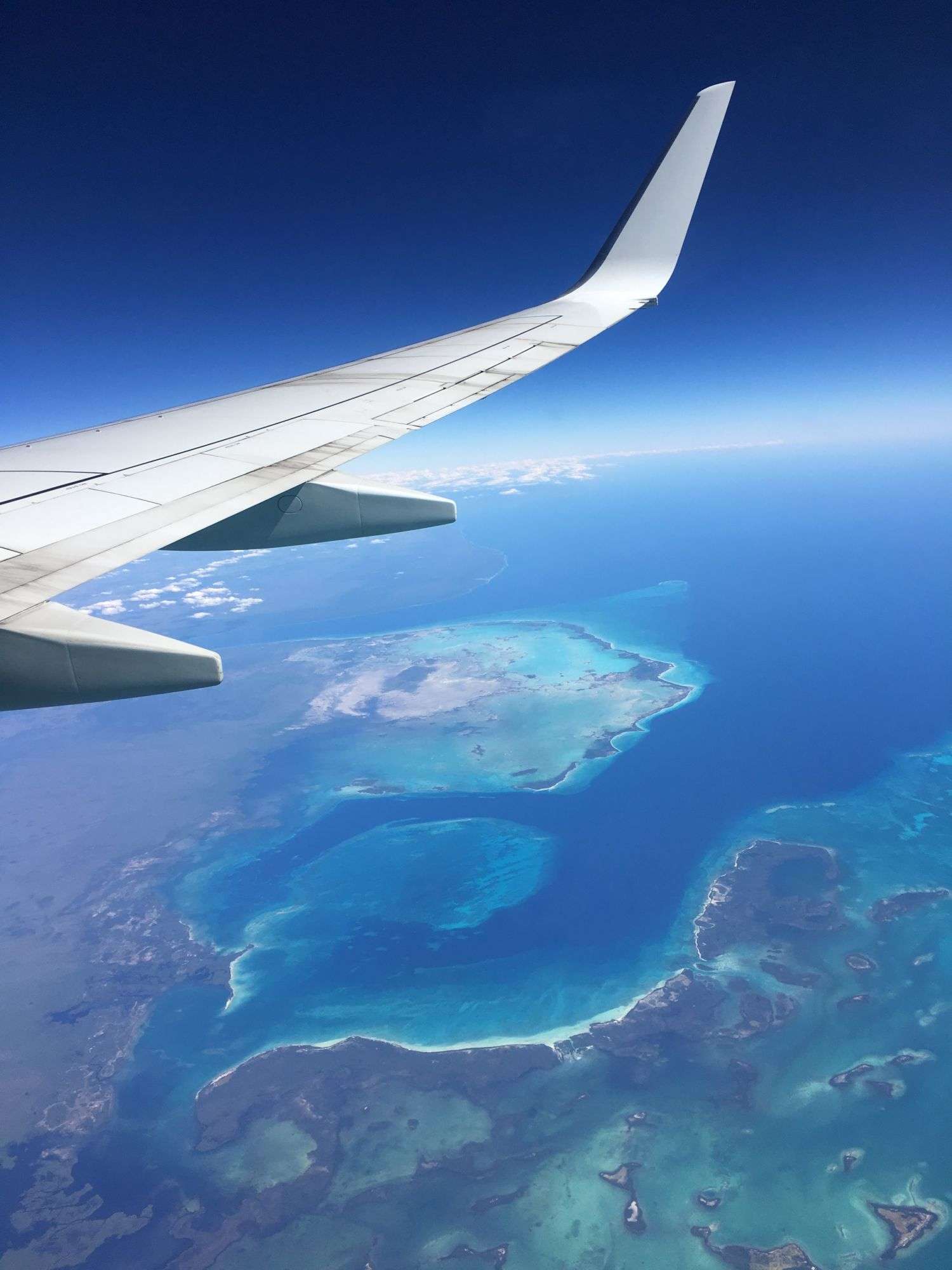 Airplane Wing with view over islands and ocean