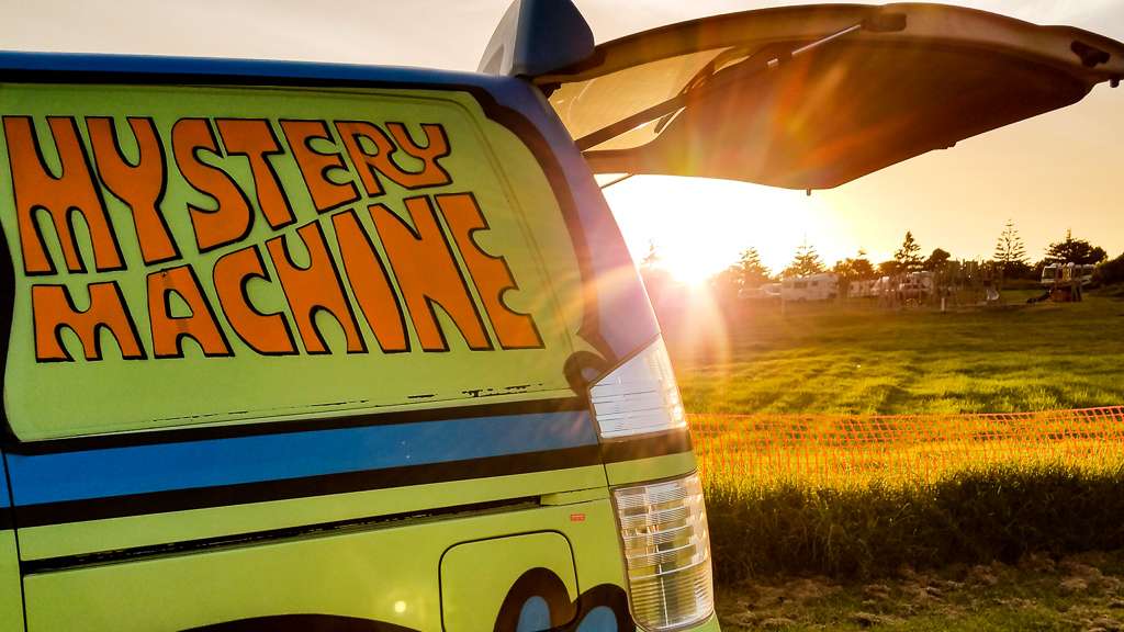 Campervan Mystery Maschine in front of sunset