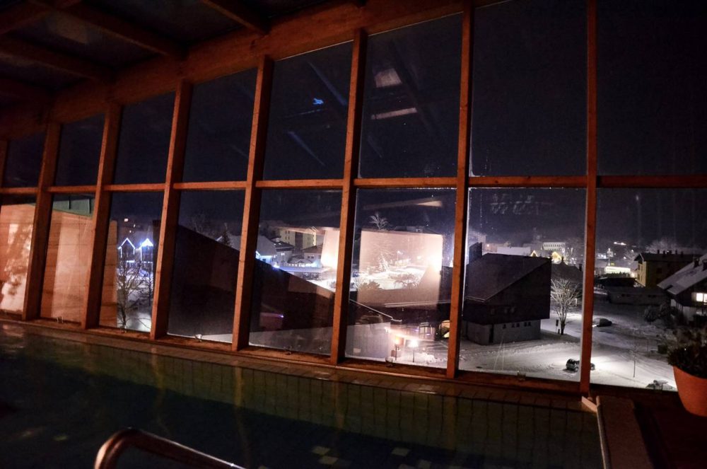 Pool view at night at Eco Hotel Bohinj - find the best ski resorts in Slovenia - the ultimate guide to skiing in Slovenia