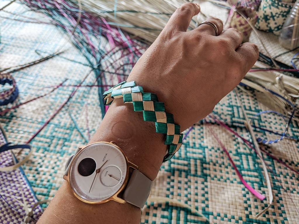 Learning how to braid Pandan leaves into bracelets