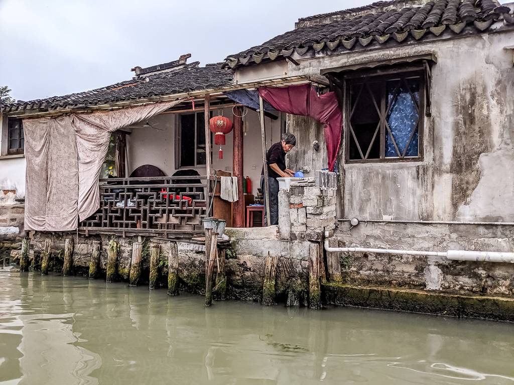 Old Woman in a house near the canals in Shan Tan Street Suzhou