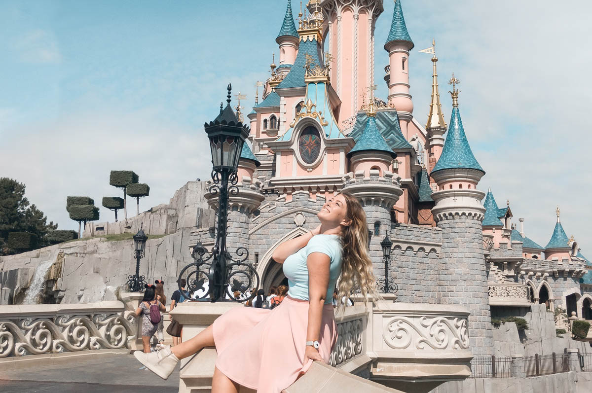 Girl in front of Sleeping Beauty Castle at Disneyland Paris