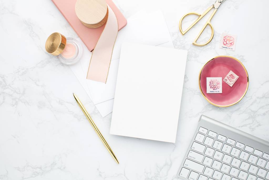 A keyboard, a pencil, paper and some stationary