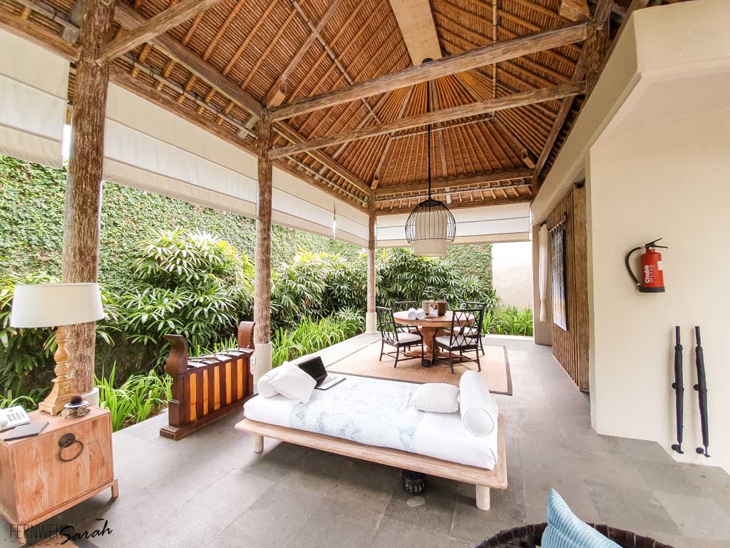 Open air living room with dining table at Kayumanis Sanur Private Villa & Spa