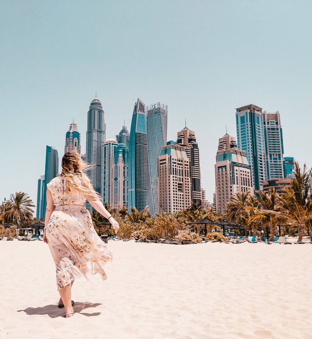 Sarah in one of her dresses for Dubai at the beach in front of the city