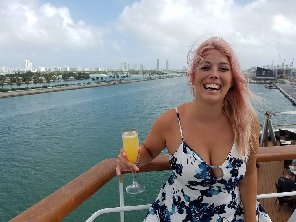 Sarah wearing a casual dress on board a cruise ship
