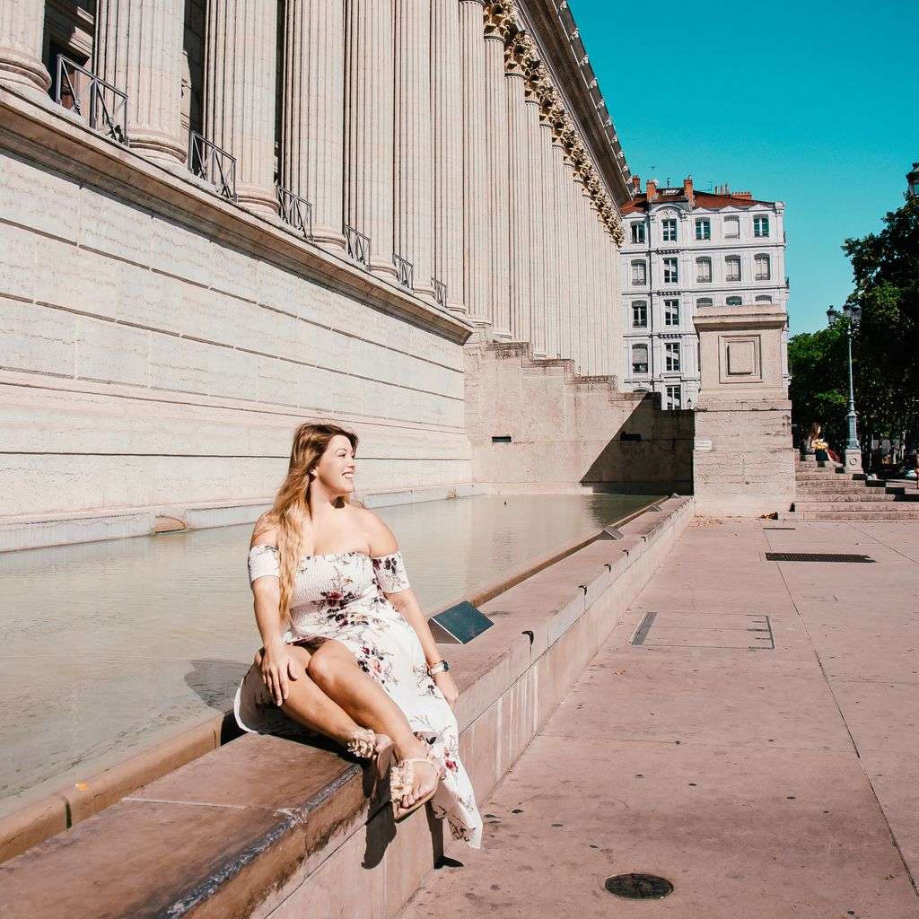 Fernwehsarah in front of the Cour d'Appel (Palace of Justice) in Lyon France - Most instagrammable Places in Lyon
